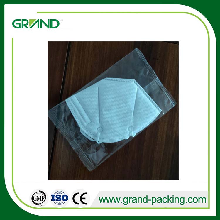Face mask flow packing machine